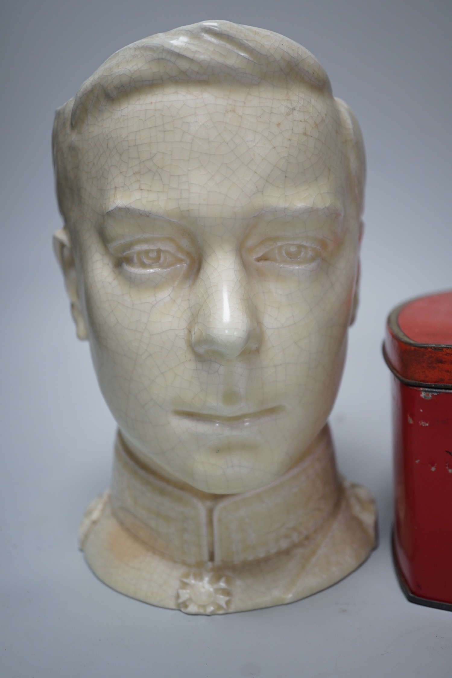 A musical Edward VII Coronation jug playing ' God save the King' and an Edward VIII biscuit tin